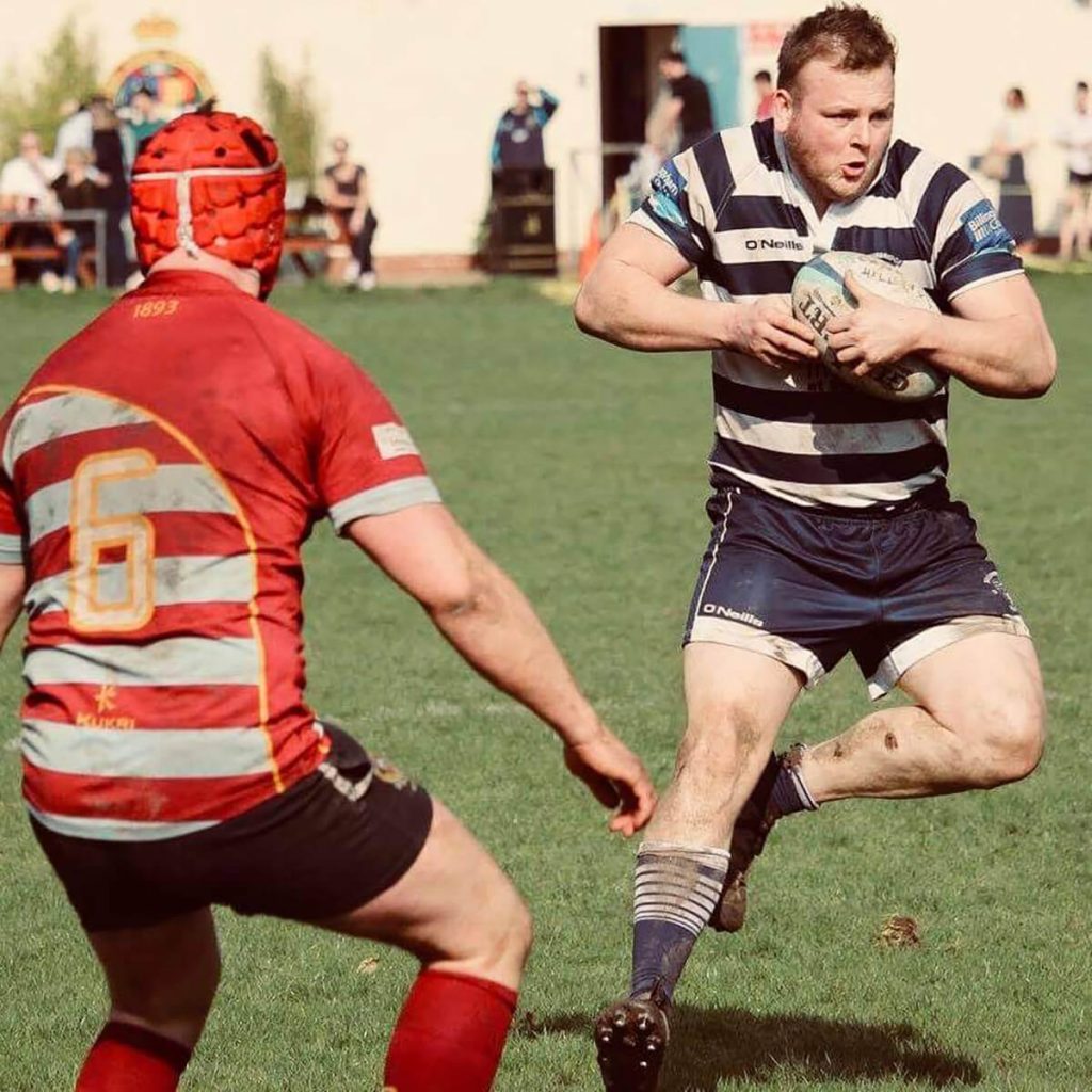 Scott playing Rugby
